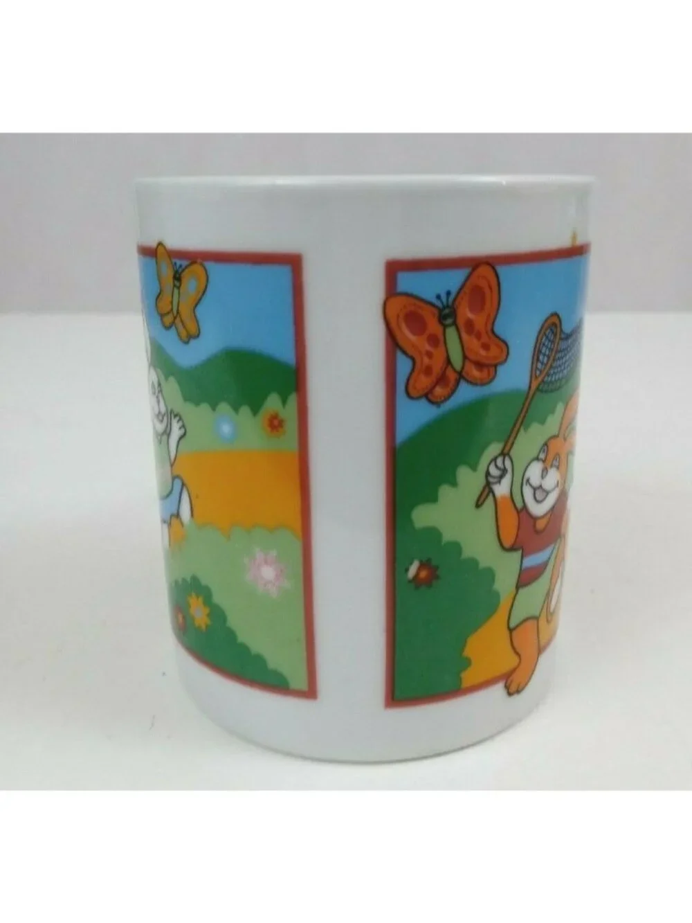 Vintage Easter Bunny Catching Butterflies Coffee Mug Cup 3.75